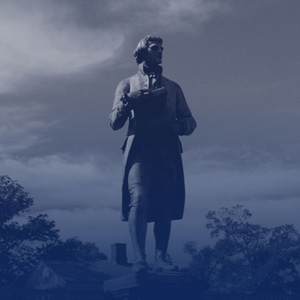 Statue of Thomas Jefferson with a duotone blue color overlay