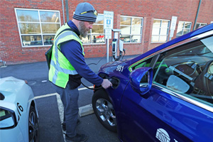 Man charging his EV