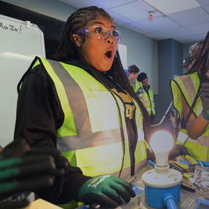 Boys & Girls Club members take part in a workshop to complete a circuit and power a lightbulb