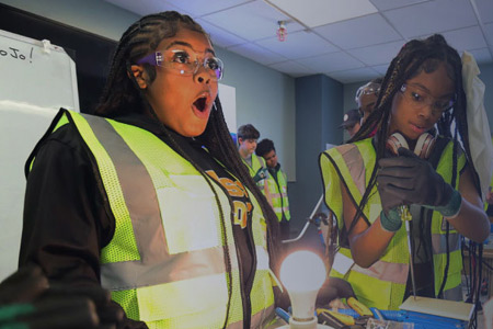 Boys & Girls Club members take part in a workshop to complete a circuit and power a lightbulb
