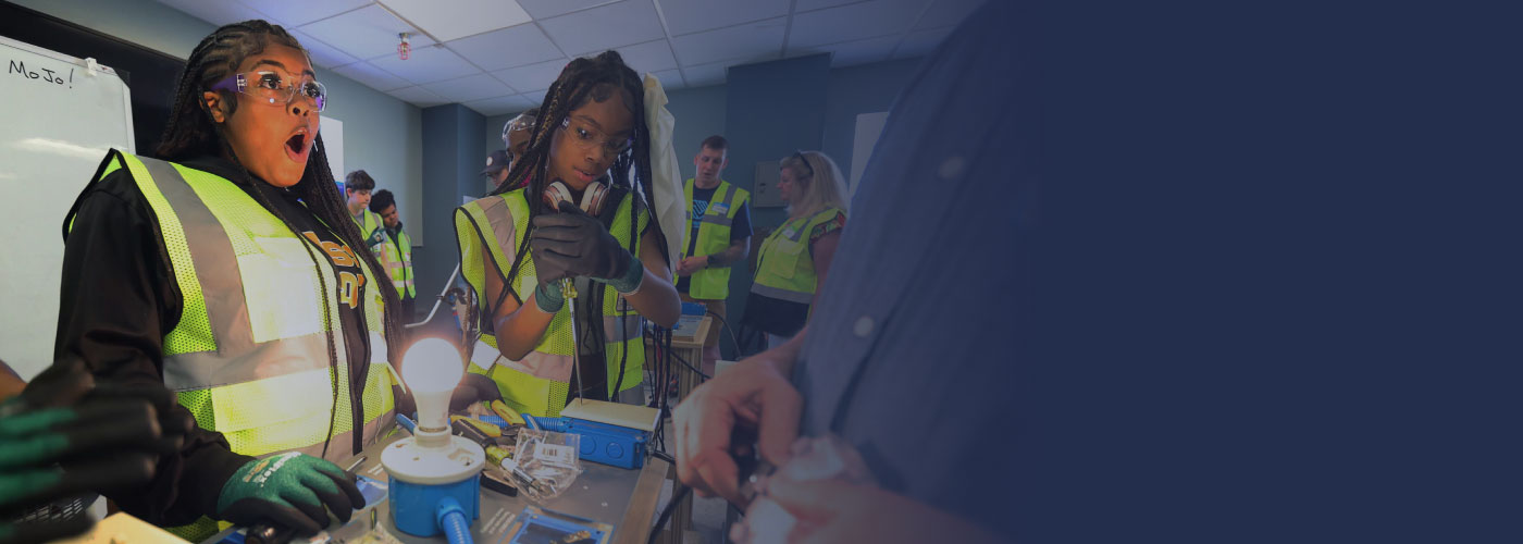 Boys & Girls Club members take part in a workshop to complete a circuit and power a lightbulb