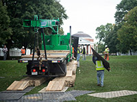Workmen slowly move crane up the Lawn to the Rotunda