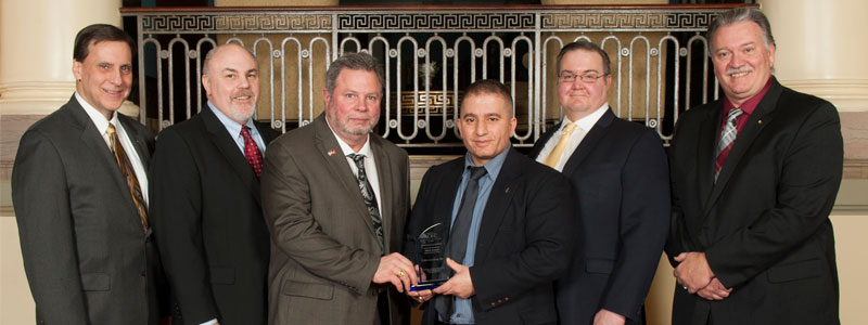 UVA Associate Director of Utilities Mark Roach and representatives from CHA Consulting accept a 2018 Merit Award from the American Council of Engineering Companies of Virginia during their Engineering Excellence Awards on February 1