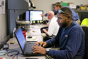 Instrumentation, Controls, and Metering employees working on computers
