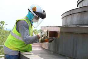 Worker polishing Rotunda's copper roof