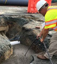 Power and Light crew member installing medium voltage ductbank