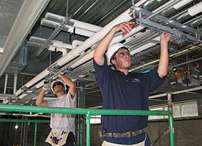Construction & Renovation Services employees hanging pipes