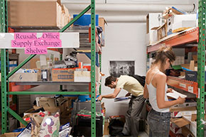 Students sorting through recycled office supplies